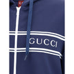 Blue Polyester SweatshirtGucci’s Jersey Hoodie combines comfort and sporty style with the house’s iconic details. Decorated with a striped print and the Gucci logo, it features a fixed hood with drawstring, long sleeves and two side pockets. Striped ribbe