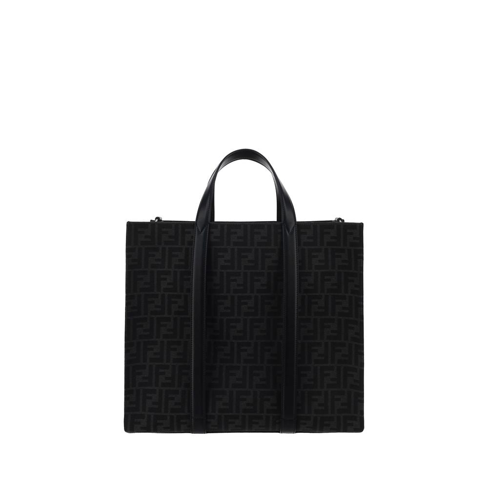 Black Polyester Shoulder BagThe Tote Handbag by Fendi features a double rigid handle at the top, a removable and adjustable leather shoulder strap, and an internal welt pocket with a zipper closure. The exterior is adorned with the brand’s iconic FF print