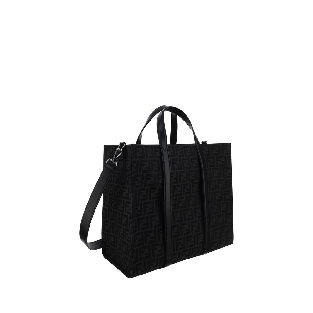 Black Polyester Shoulder BagThe Tote Handbag by Fendi features a double rigid handle at the top, a removable and adjustable leather shoulder strap, and an internal welt pocket with a zipper closure. The exterior is adorned with the brand’s iconic FF print