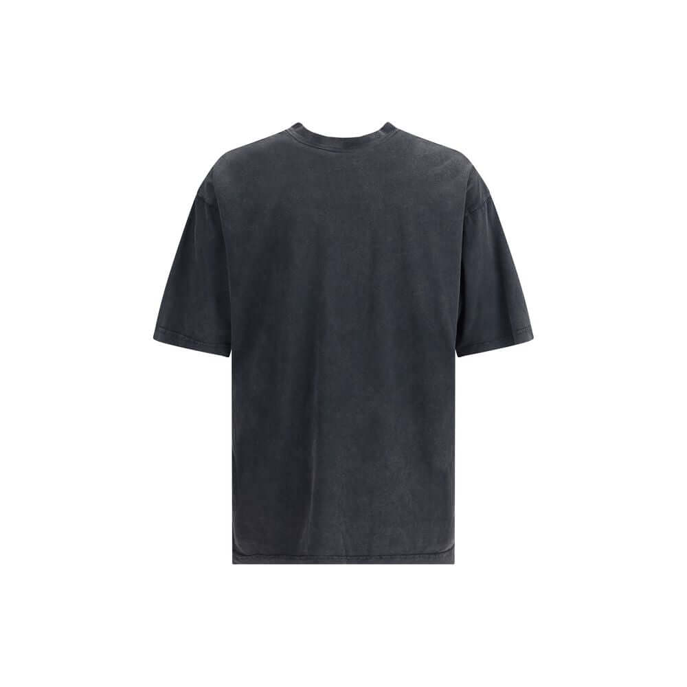 Gray Cotton T-ShirtBalenciaga’s cotton T-Shirt is an essential garment with distinctive character. Made from soft cotton, it features a ribbed crew neck and a printed logo on the front for a minimalist yet instantly recognizable look. Season: AW25 Fit: Re