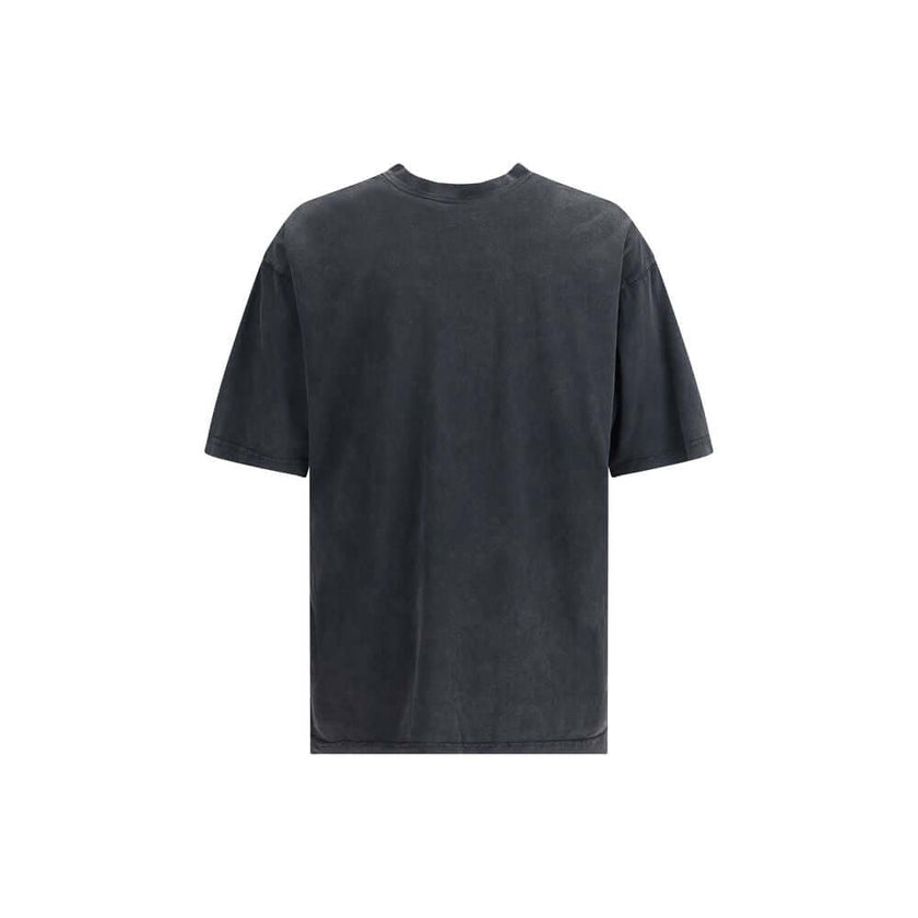 Gray Cotton T-ShirtBalenciaga’s cotton T-Shirt is an essential garment with distinctive character. Made from soft cotton, it features a ribbed crew neck and a printed logo on the front for a minimalist yet instantly recognizable look. Season: AW25 Fit: Re