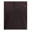 Brown Cashmere Cashmere SweaterBurberry’s cashmere long-sleeved polo sweater is a garment that combines the softness of fine yarn with the house’s iconic details. Made from pure cashmere, it offers a comfortable fit and a luxurious feel against the skin.