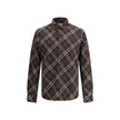 Brown Cotton Pattern ShirtBurberry’s Check cotton flannel Shirt is a timeless classic that combines tradition and contemporary style. Made of soft cotton flannel woven with the famous Burberry Check pattern, it features long sleeves, a button-down collar