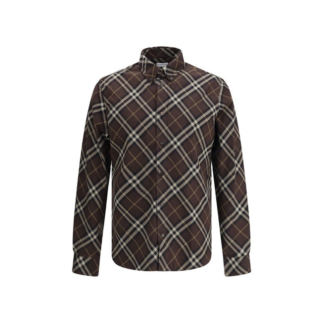 Brown Cotton Pattern ShirtBurberry’s Check cotton flannel Shirt is a timeless classic that combines tradition and contemporary style. Made of soft cotton flannel woven with the famous Burberry Check pattern, it features long sleeves, a button-down collar