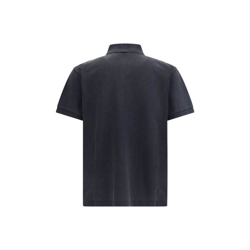 Black Cotton Polo ShirtBalenciaga’s cotton polo shirt reinterprets a wardrobe classic with the brand’s sharp, essential style. Featuring a classic collar with a two-button closure, it has short sleeves with cuffs and an embroidered logo on the chest for a