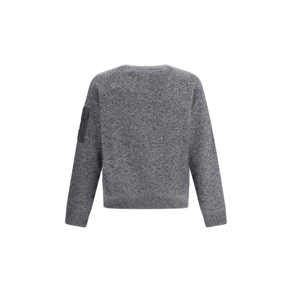Wool mouliné and cashmere SweaterMoncler’s wool mouliné and cashmere Sweater is a refined garment that combines softness and superior quality. Made of a fine wool and cashmere mouliné blend with a shaved knit of fineness 7, it features a classic crew neck