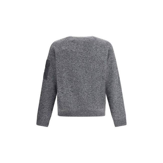 Wool mouliné and cashmere SweaterMoncler’s wool mouliné and cashmere Sweater is a refined garment that combines softness and superior quality. Made of a fine wool and cashmere mouliné blend with a shaved knit of fineness 7, it features a classic crew neck