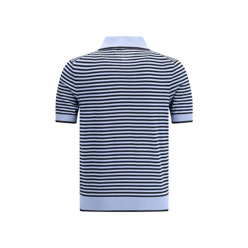 Striped polo SweaterPrada’s Striped polo Sweater combines sporty style with sophisticated details. Featuring a ribbed collar and a three-button front closure, it has a ribbed finished hem for an impeccable fit. The jacquard logo on the front signs the gar