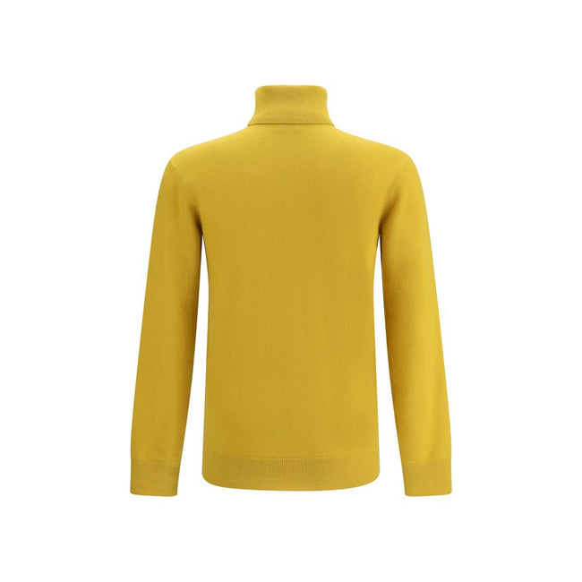 Yellow Cashmere TurtleneckThe Saint Laurent Cashmere Turtleneck Sweater is an essential garment with a sophisticated and timeless style. Made of high-quality wool, it offers warmth and comfort, ideal for the colder seasons. The high ribbed collar, along w