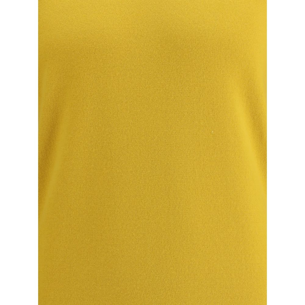 Yellow Cashmere TurtleneckThe Saint Laurent Cashmere Turtleneck Sweater is an essential garment with a sophisticated and timeless style. Made of high-quality wool, it offers warmth and comfort, ideal for the colder seasons. The high ribbed collar, along w