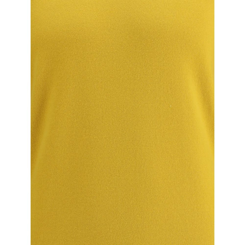 Yellow Cashmere TurtleneckThe Saint Laurent Cashmere Turtleneck Sweater is an essential garment with a sophisticated and timeless style. Made of high-quality wool, it offers warmth and comfort, ideal for the colder seasons. The high ribbed collar, along w