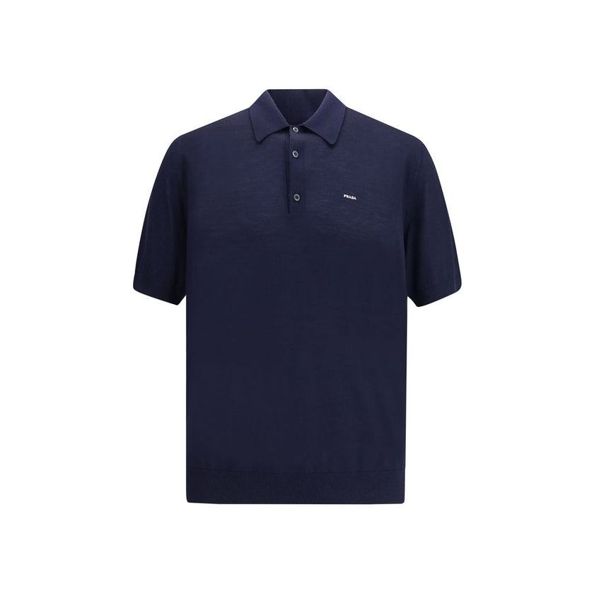 Blue Fleece Wool Polo ShirtPrada’s virgin wool polo Sweater combines elegance and simplicity in a timeless design. Featuring a classic ribbed collar, it has a matching hem and a discreet logo on the front, understatedly signing the garment’s refined aesth