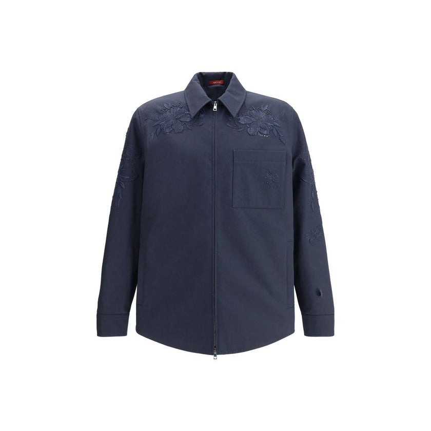 Blue Cotton Denim JacketGucci’s cotton Jacket with embroidery is made of black cotton twill, featuring a Web detail on the back and an embossed Gucci logo to highlight its identity. It features a pointed collar, functional front pockets and long sleeves,