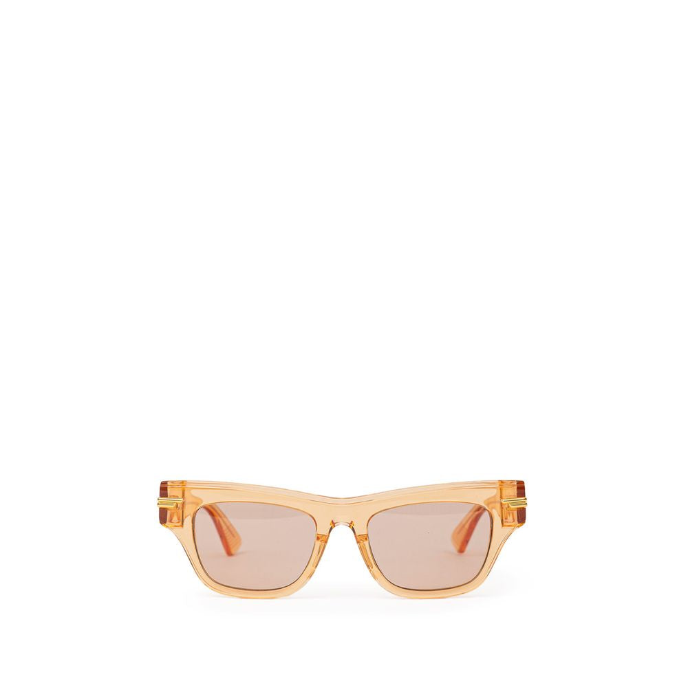 Orange Acetate SunglassesBottega Veneta Orange Recycled Acetate Sunglasses. Transparent crystal effect frame, orange lens, gold details on the temples Composition: Acetate Internal SKU: 25GIU77 Brand SKU: 669573V2Q307505Orange Acetate Sunglasses${tagsBott