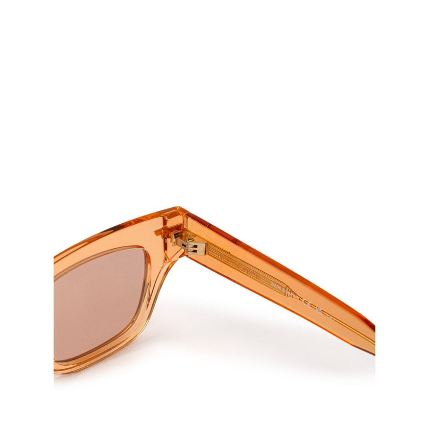 Orange Acetate SunglassesBottega Veneta Orange Recycled Acetate Sunglasses. Transparent crystal effect frame, orange lens, gold details on the temples Composition: Acetate Internal SKU: 25GIU77 Brand SKU: 669573V2Q307505Orange Acetate Sunglasses${tagsBott