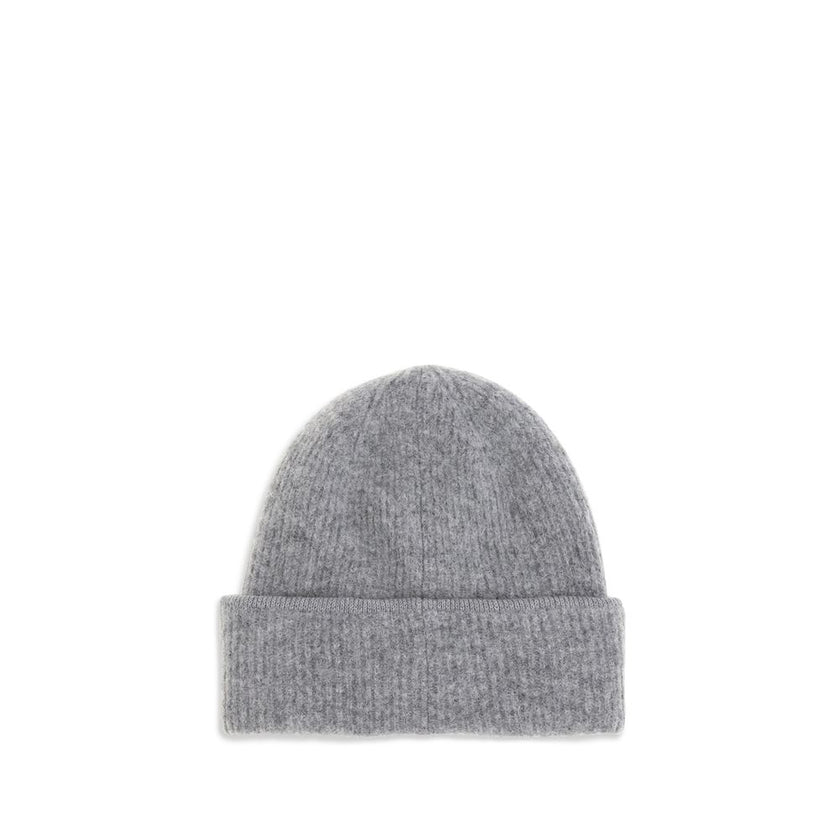 Gros Grain Ribbed BeanieThe Gros Grain Ribbed Beanie by Jacquemus combines style and functionality. The adjustable fit ensures comfort, while the contrasting folded brim and tone-on-tone gros-grain logo embroidered on the front complete the design with a