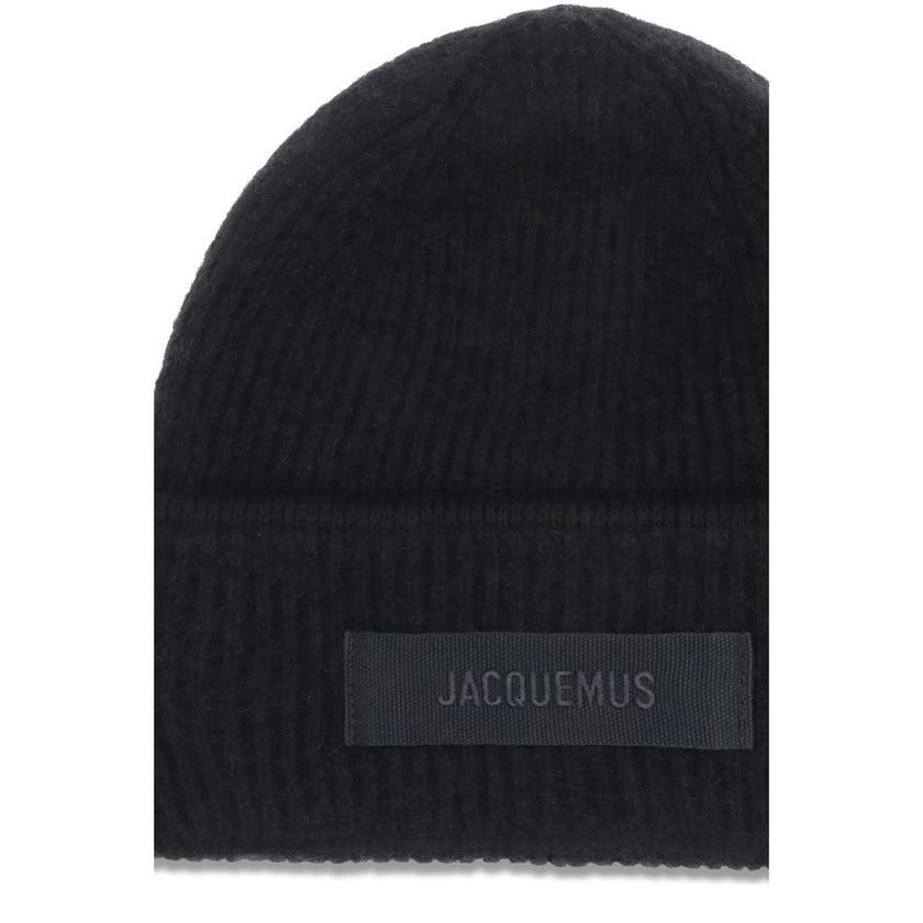 Black Alpaca Vicugna Pacos BeanieThe Gros Grain Ribbed Beanie by Jacquemus combines style and functionality. The adjustable fit ensures comfort, while the contrasting folded brim and tone-on-tone gros-grain logo embroidered on the front complete the desig