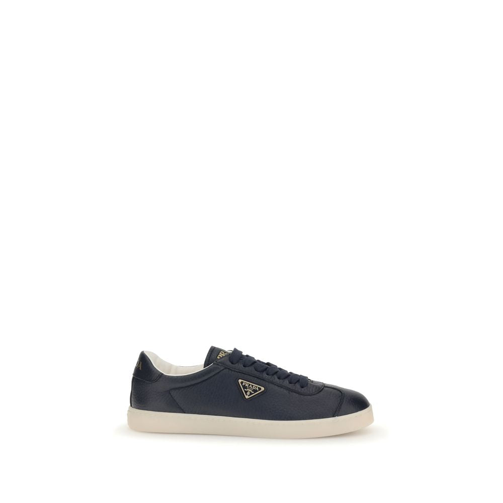 Blue Calf Leather Bos Taurus Low Top SneakersPrada’s leather Sneakers are made of fine grained deerskin leather and feature an embossed logo on the back, along with the iconic logo triangle on the side. They feature a lace-up closure, a logo-printed tongu