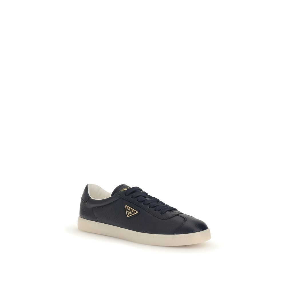 Blue Calf Leather Bos Taurus Low Top SneakersPrada’s leather Sneakers are made of fine grained deerskin leather and feature an embossed logo on the back, along with the iconic logo triangle on the side. They feature a lace-up closure, a logo-printed tongu