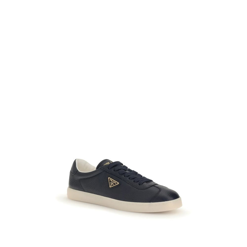 Blue Calf Leather Bos Taurus Low Top SneakersPrada’s leather Sneakers are made of fine grained deerskin leather and feature an embossed logo on the back, along with the iconic logo triangle on the side. They feature a lace-up closure, a logo-printed tongu