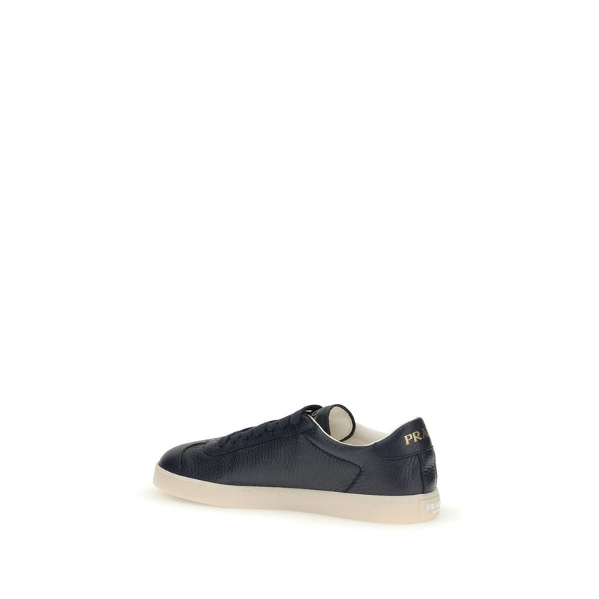 Blue Calf Leather Bos Taurus Low Top SneakersPrada’s leather Sneakers are made of fine grained deerskin leather and feature an embossed logo on the back, along with the iconic logo triangle on the side. They feature a lace-up closure, a logo-printed tongu