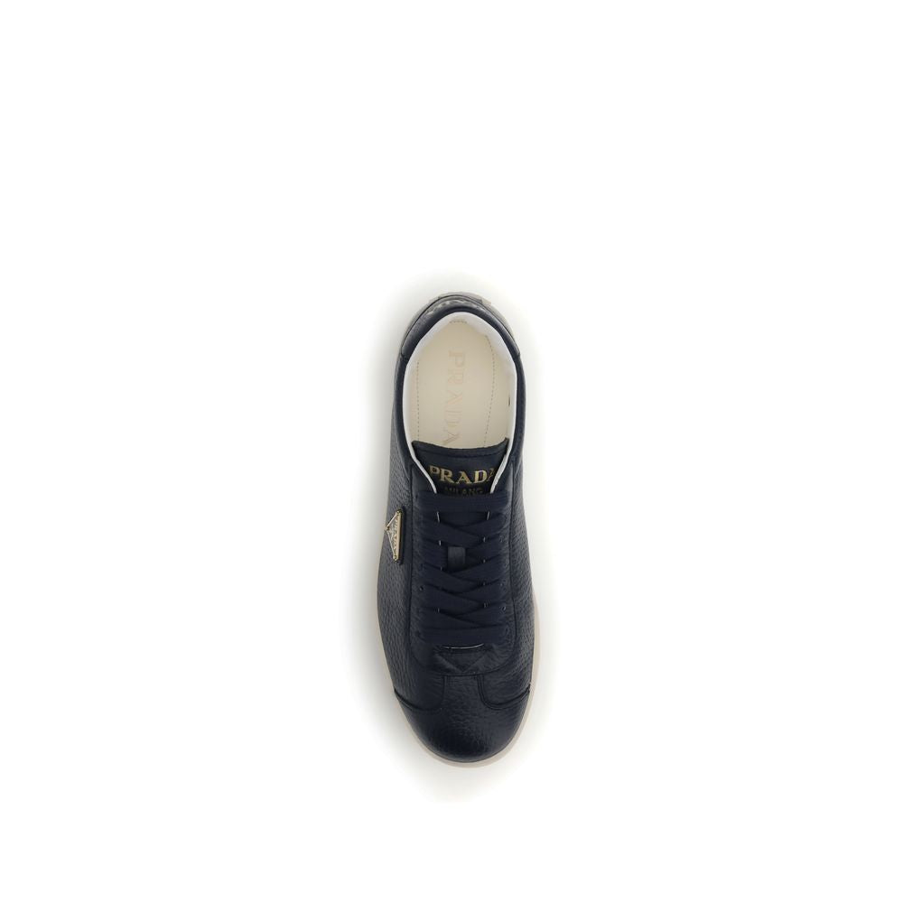 Blue Calf Leather Bos Taurus Low Top SneakersPrada’s leather Sneakers are made of fine grained deerskin leather and feature an embossed logo on the back, along with the iconic logo triangle on the side. They feature a lace-up closure, a logo-printed tongu
