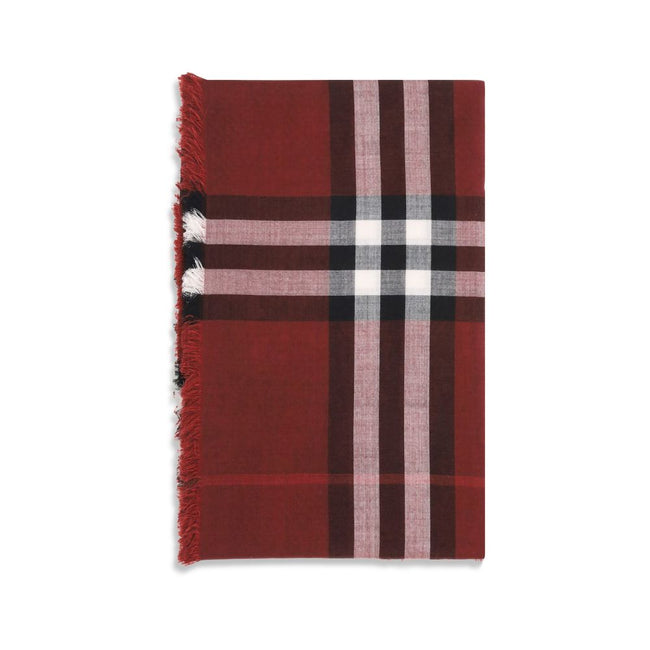 Red Wool ScarfThe Reversible Check wool and silk Scarf by Burberry is crafted in lightweight wool and silk muslin. The iconic Burberry Check pattern in this season’s Oxblood and Post Red shades adds a sophisticated, distinctive touch. Its rectangular shap