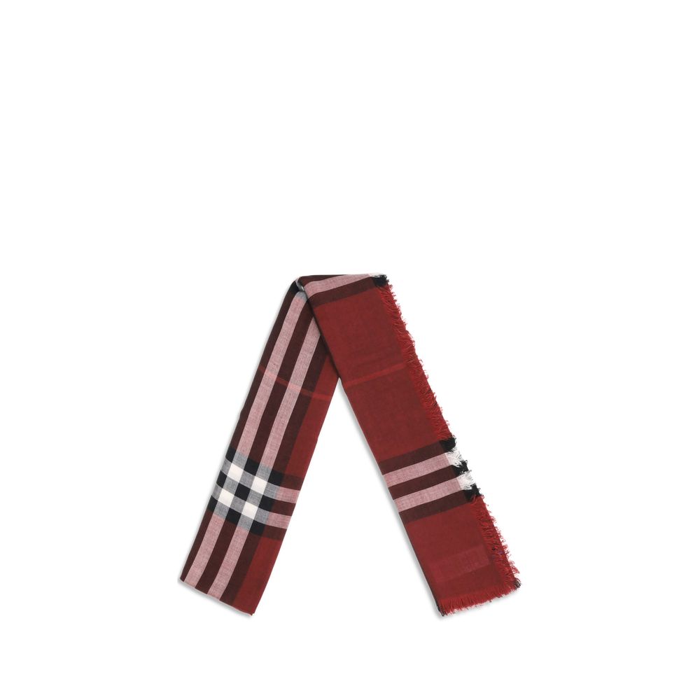 Red Wool ScarfThe Reversible Check wool and silk Scarf by Burberry is crafted in lightweight wool and silk muslin. The iconic Burberry Check pattern in this season’s Oxblood and Post Red shades adds a sophisticated, distinctive touch. Its rectangular shap