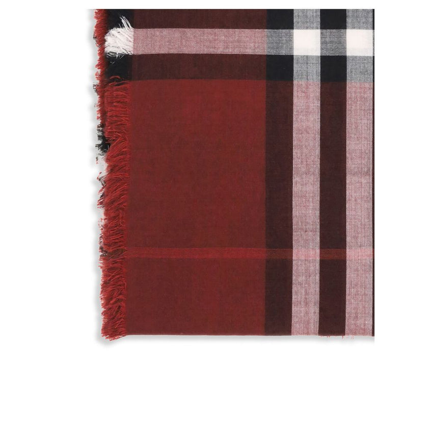 Red Wool ScarfThe Reversible Check wool and silk Scarf by Burberry is crafted in lightweight wool and silk muslin. The iconic Burberry Check pattern in this season’s Oxblood and Post Red shades adds a sophisticated, distinctive touch. Its rectangular shap