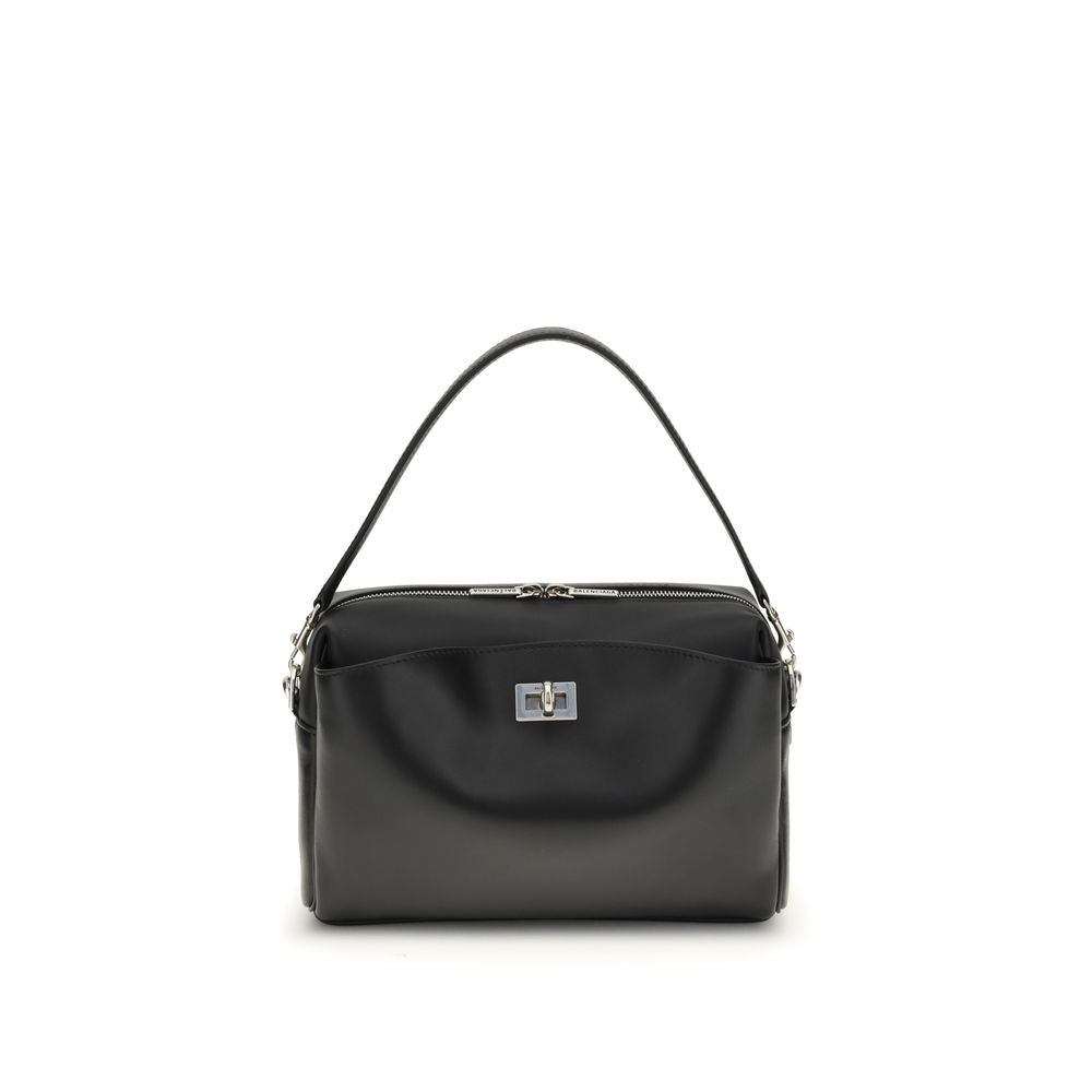 Black Calf Leather Bos Taurus Shoulder BagThe Rodeo Camera Bag by Balenciaga is crafted from smooth black calf leather with antique silver-tone hardware. Versatile and practical, it can be worn crossbody, over the shoulder, or by hand, thanks to the remov
