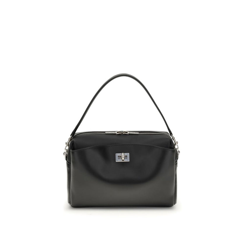 Black Calf Leather Bos Taurus Shoulder BagThe Rodeo Camera Bag by Balenciaga is crafted from smooth black calf leather with antique silver-tone hardware. Versatile and practical, it can be worn crossbody, over the shoulder, or by hand, thanks to the remov