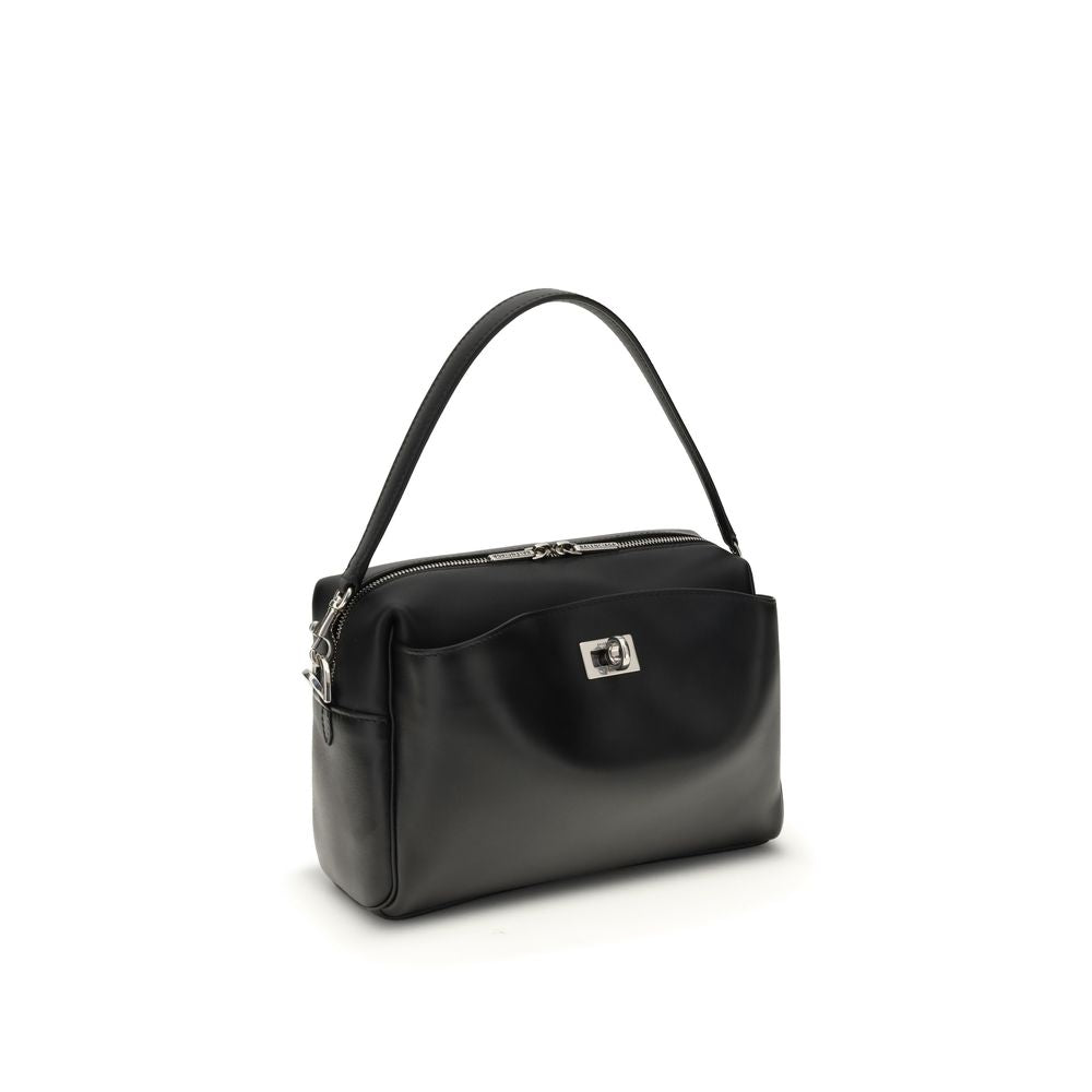 Black Calf Leather Bos Taurus Shoulder BagThe Rodeo Camera Bag by Balenciaga is crafted from smooth black calf leather with antique silver-tone hardware. Versatile and practical, it can be worn crossbody, over the shoulder, or by hand, thanks to the remov