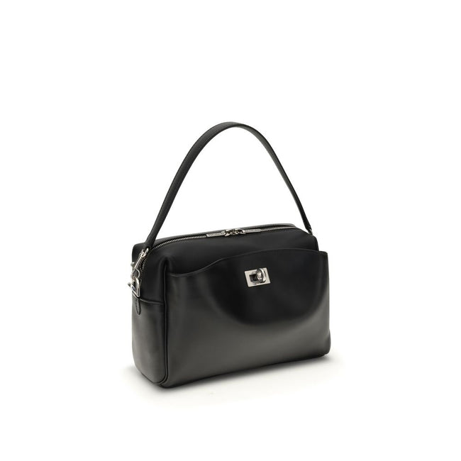 Black Calf Leather Bos Taurus Shoulder BagThe Rodeo Camera Bag by Balenciaga is crafted from smooth black calf leather with antique silver-tone hardware. Versatile and practical, it can be worn crossbody, over the shoulder, or by hand, thanks to the remov