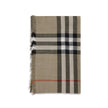 Beige Wool ScarfThe Burberry Check Reversible Wool and Silk Scarf is crafted in lightweight muslin in Italy. This rectangular scarf features the Burberry Check print in seasonal sand and brown Vole tones, with short, delicate fringes along the edges, comb