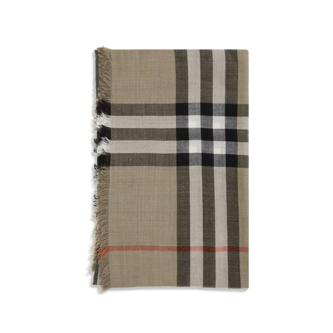 Beige Wool ScarfThe Burberry Check Reversible Wool and Silk Scarf is crafted in lightweight muslin in Italy. This rectangular scarf features the Burberry Check print in seasonal sand and brown Vole tones, with short, delicate fringes along the edges, comb