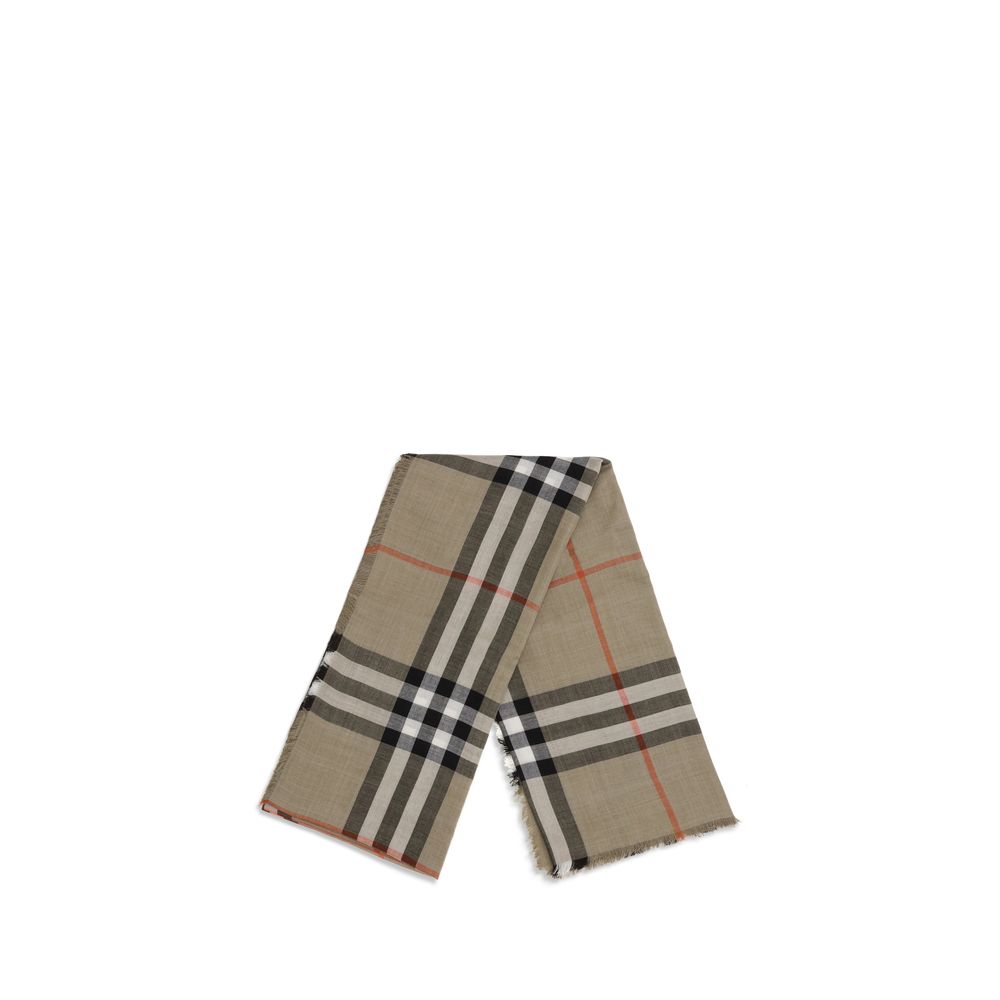 Beige Wool ScarfThe Burberry Check Reversible Wool and Silk Scarf is crafted in lightweight muslin in Italy. This rectangular scarf features the Burberry Check print in seasonal sand and brown Vole tones, with short, delicate fringes along the edges, comb