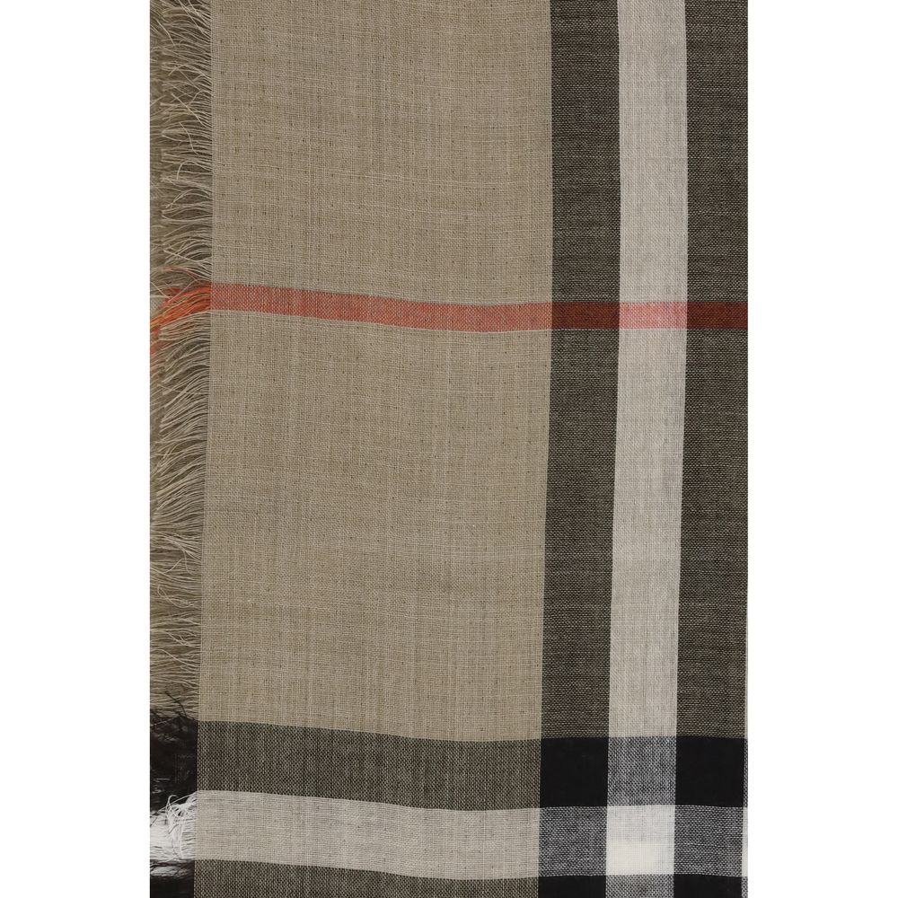 Beige Wool ScarfThe Burberry Check Reversible Wool and Silk Scarf is crafted in lightweight muslin in Italy. This rectangular scarf features the Burberry Check print in seasonal sand and brown Vole tones, with short, delicate fringes along the edges, comb
