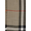 Beige Wool ScarfThe Burberry Check Reversible Wool and Silk Scarf is crafted in lightweight muslin in Italy. This rectangular scarf features the Burberry Check print in seasonal sand and brown Vole tones, with short, delicate fringes along the edges, comb