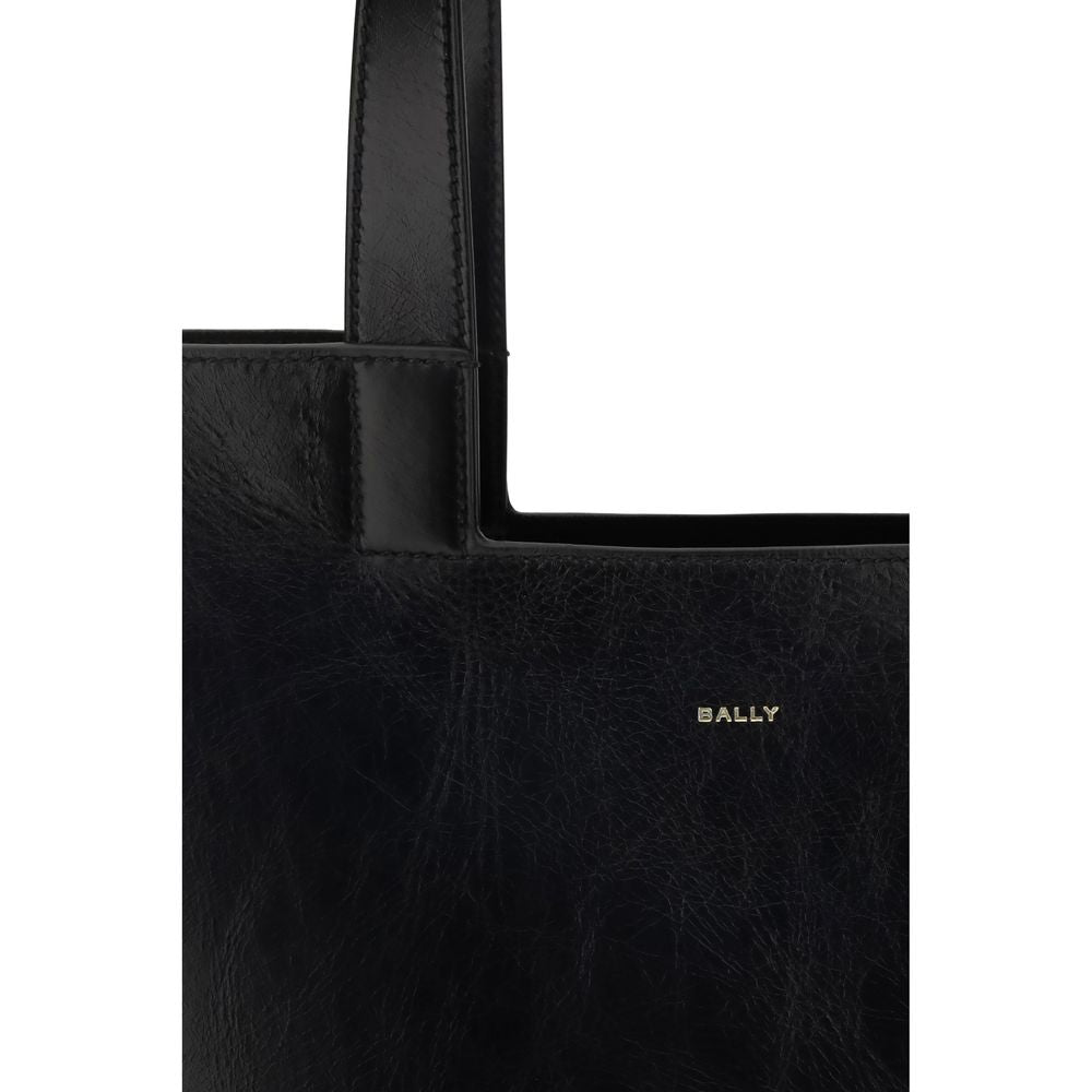 Black Calf Leather Bos Taurus Shoulder BagThe Bally Tote Bag is reimagined in a simple, minimalist style, featuring clean lines and a versatile shape suitable for any occasion. Made from calf leather with crêpe finishes, it features a gold-laminated logo,