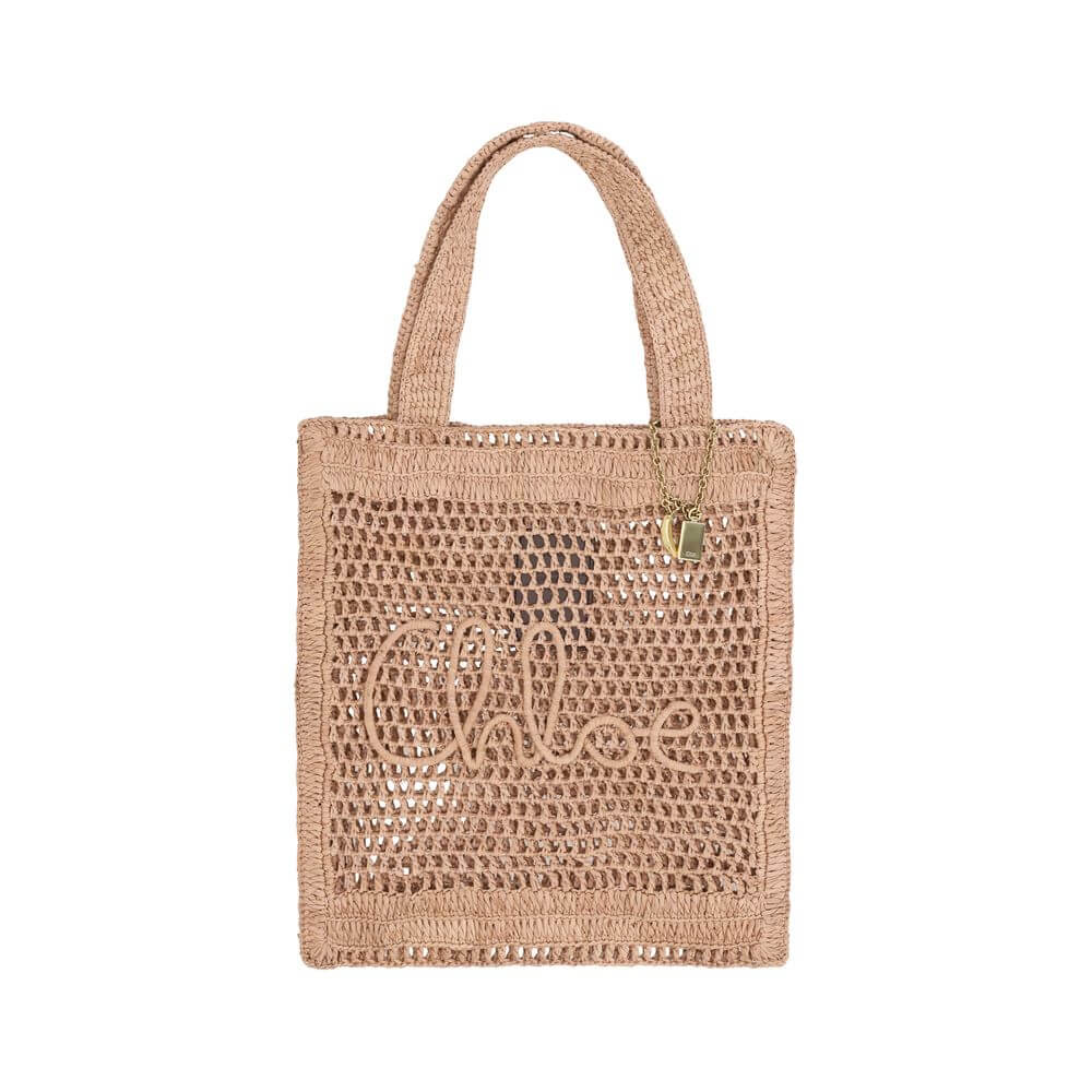 Brown Raffia Shoulder BagChloé’s Summer Banana Tote Bag is an elegant and cool accessory made of raffia with a perforated weave. It has two top handles for convenient carrying and features the iconic monogram embroidered on the front. A golden banana-shap