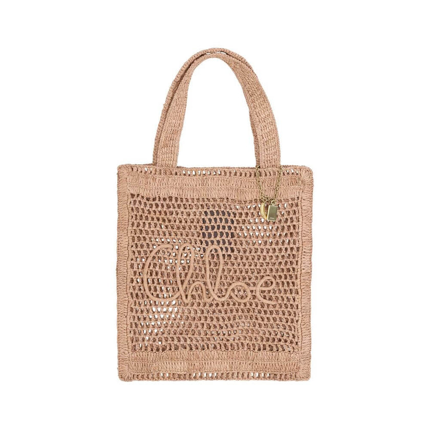 Brown Raffia Shoulder BagChloé’s Summer Banana Tote Bag is an elegant and cool accessory made of raffia with a perforated weave. It has two top handles for convenient carrying and features the iconic monogram embroidered on the front. A golden banana-shap