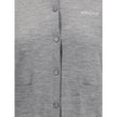 Gray Cashmere CardiganGucci’s cashmere Cardigan is a timeless garment, the epitome of elegance and comfort. Featuring a ribbed crew neck, hem and cuffs, it has a front button closure and two small patch pockets on the front. The iconic stitched signature