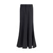 Black Fleece Wool Long SkirtBalenciaga’s virgin wool Godet skirt-trousers feature a mid-rise waist, front buttons, belt loops and inner pants for a versatile and refined style. Season: AW25 Fit: Regular Composition: 100% Fleece Wool MADE IN ITALYBlack Fle