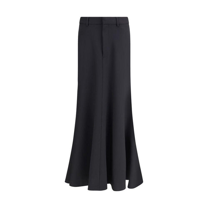 Black Fleece Wool Long SkirtBalenciaga’s virgin wool Godet skirt-trousers feature a mid-rise waist, front buttons, belt loops and inner pants for a versatile and refined style. Season: AW25 Fit: Regular Composition: 100% Fleece Wool MADE IN ITALYBlack Fle