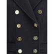 Black Wool CoatThe double-breasted coat by Balmain combines sophistication with contemporary modernity. Crafted from fine wool, its streamlined silhouette with broad shoulders and wide lapels flatters the figure, while the engraved gold buttons, decorativ