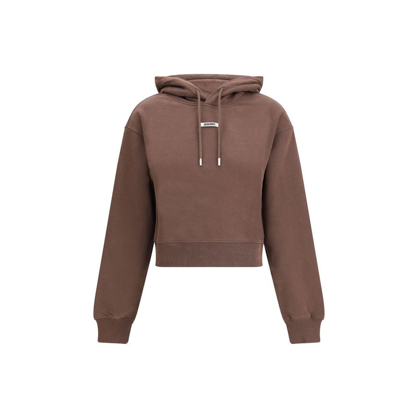Logoed HoodieCotton Hoodie by Jacquemus, featuring an adjustable drawstring hood for a custom fit. Featuring a logo patch on the front, ribbed cuffs and hem for a finishing touch. The slim fit flatters the silhouette, combining comfort and contemporary st