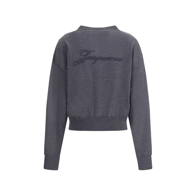 Merino wool CardiganMerino wool Cardigan by Jacquemus combines elegance and comfort with a V-neckline and front button closure. Finished with a ribbed hem and cuffs, it is embellished with an embroidered logo on the back for a distinctive, modern touch. S