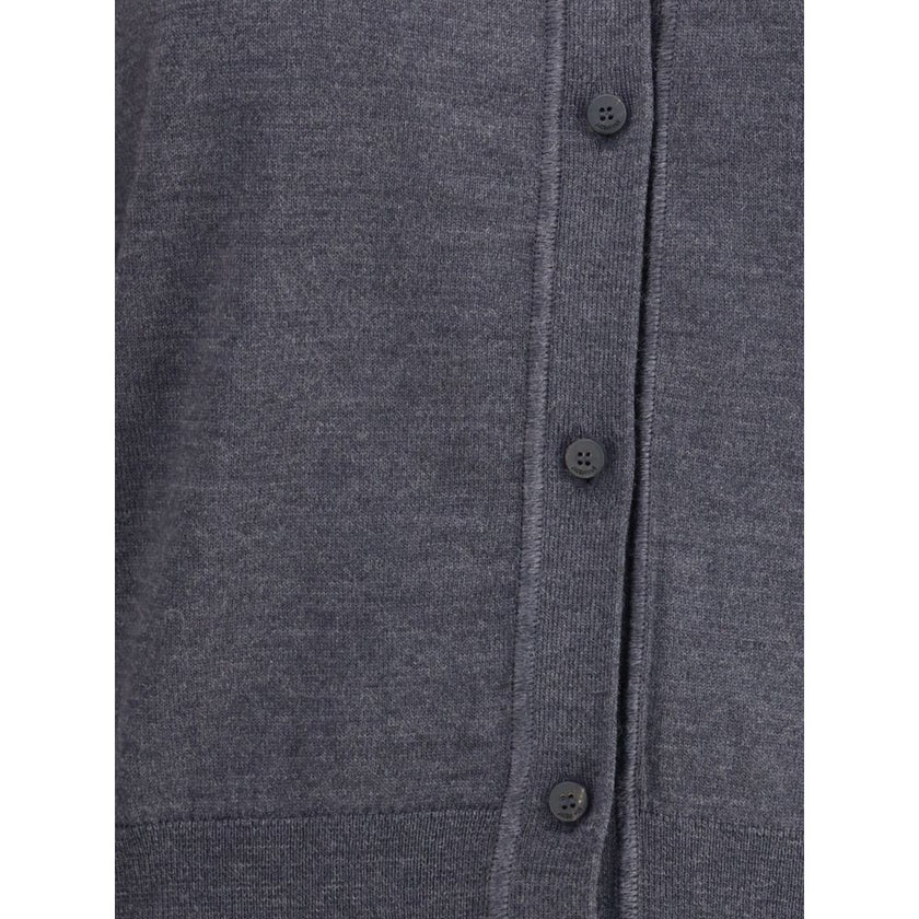 Merino wool CardiganMerino wool Cardigan by Jacquemus combines elegance and comfort with a V-neckline and front button closure. Finished with a ribbed hem and cuffs, it is embellished with an embroidered logo on the back for a distinctive, modern touch. S