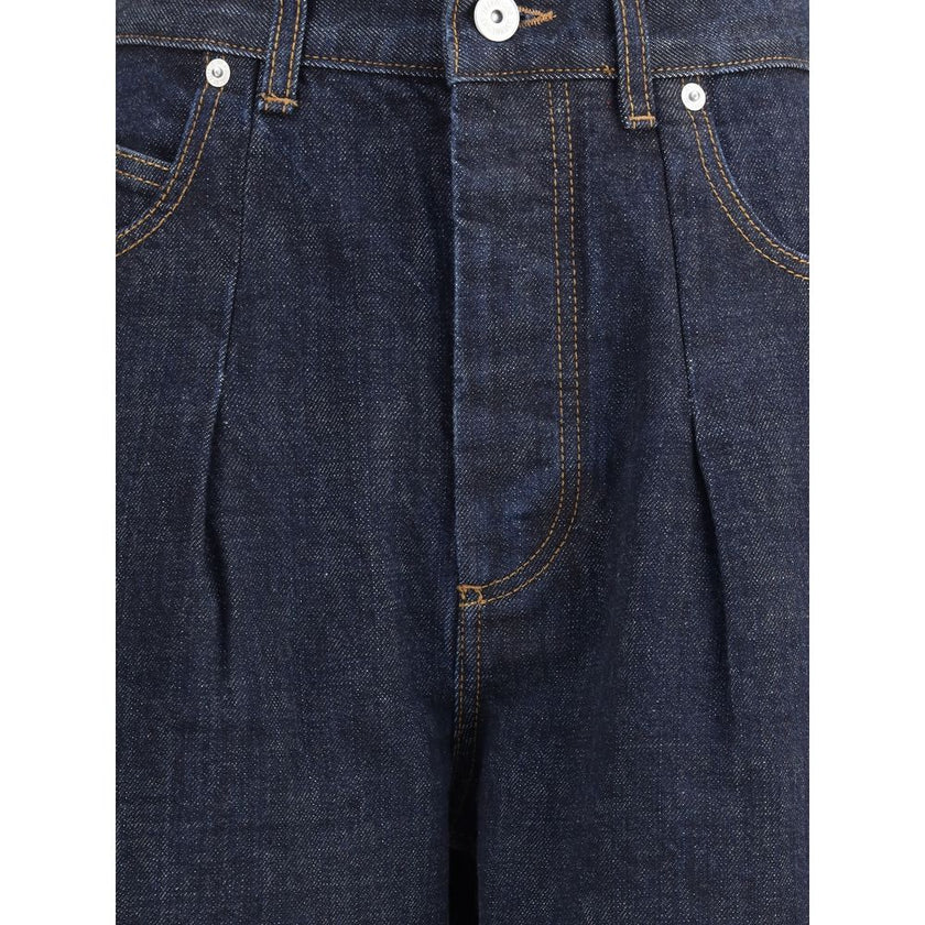 Blue Cotton Relaxed Fit JeansLe de-Nimes oversized Jeans by Jacquemus feature a balloon-leg design that creates a wide, modern silhouette. They feature a front button closure, five classic pockets and belt loops, combining bold style and functionality. Se