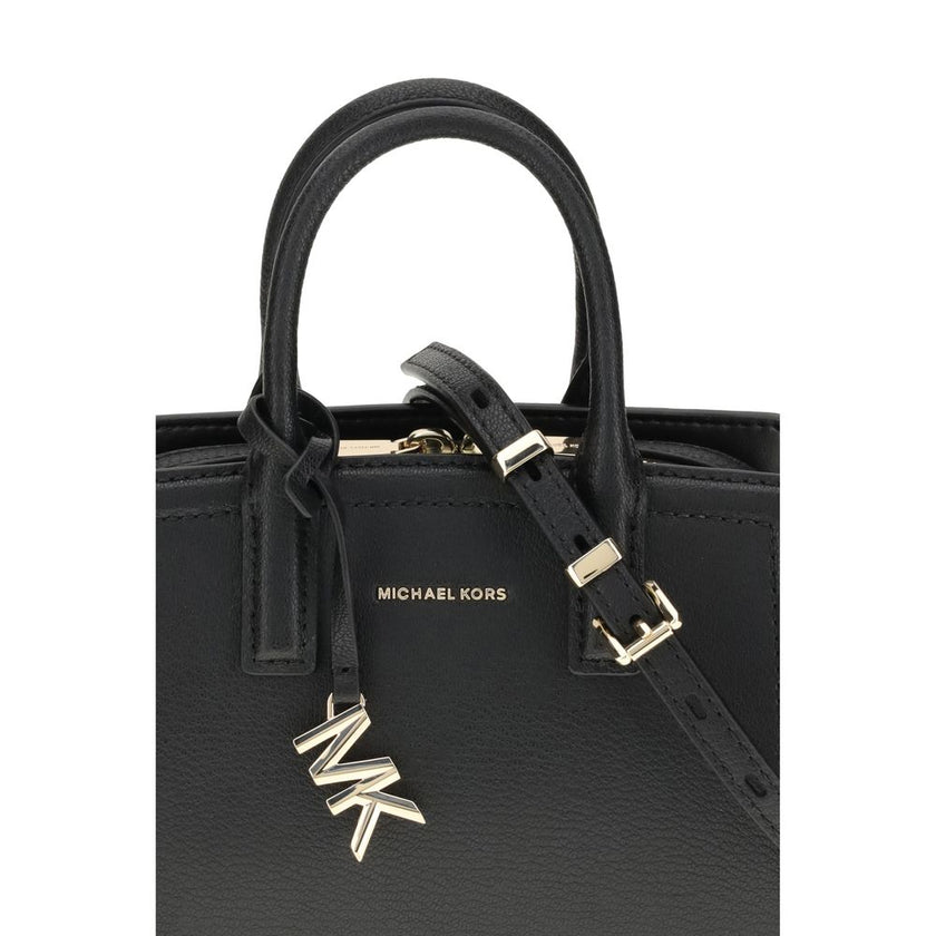 Black Calf Leather Bos Taurus Shoulder BagThe Laila Bag by Michael Kors is a compact and functional reinterpretation of the iconic model. Featuring an adjustable shoulder strap, top handle, and two-way zip closure, it has a compartmentalized interior desi